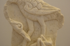 Relief of a bird and grasshopper. Apollonia Archaeological Museum.