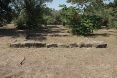 Western of the two rectangular buildings south of Apollo\'s Obelisk.