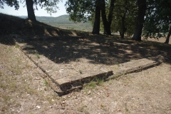 Eastern of the two rectangular buildings south of Apollo\'s Obelisk.