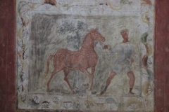 Painted wall panel with a circus scene, part of the room reconstruction.