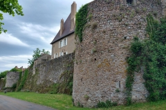 City walls along Boulevard Mac Mahon between Rue de Faubourg Talus and the Tour des Ursulines.