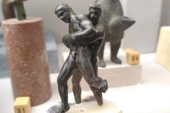 Small bronze statuette of wrestlers. Found in the Rue du Faubourg Saint-Jean area of Autun. Dated to the 2nd-3rd century CE.