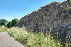 Western extent of the city walls along Chemin Derrière les Murs.