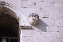 Theater relief  high on the north facade of the Cattedrale Metropolitana di Santa Maria de Episcopio bell tower.