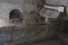 Niche, funerary bed, and mosaic flooring in the Roman Tomb.