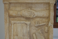 Funerary relief with depictions of writing instruments and a musical instrument called a nabilium. Dated to the 1st century CE. Archaeological Museum of Dion.