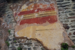 Preserved wall painting in the lower portico of the odeon.
