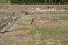 Monument base and paving in the forum adjacent to the curia.