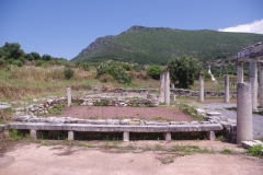 Benches along the wall of the third room from the north in the palaestra.