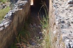 Aqueduct channel between bridges with intact covering.