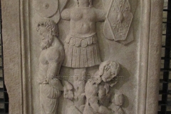Relief depicting a trophaeum and captives. Dated to the 2nd century CE and found in the area of Piazza Oberdan. Tergeste Lapidarium.