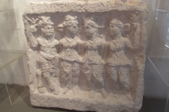 Votive relief depicting Silvanus and three Nymphs dedicated by Primagenivola. Dated to the 3rd century CE. Museo d’Antichità.